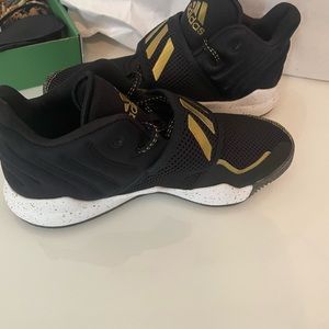 Boy’s Gold and Black Adidas shoes. Size 5US.